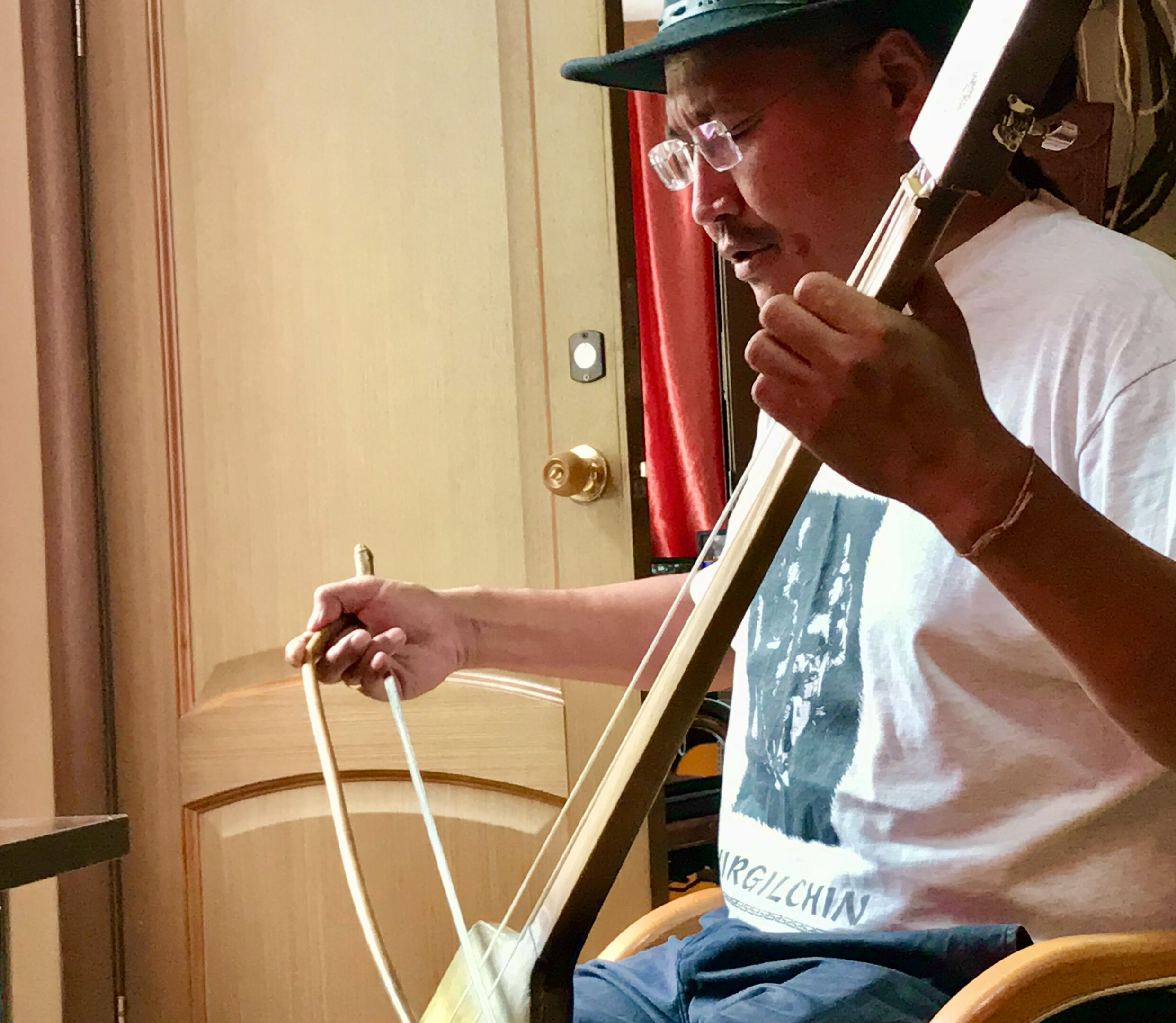 IGOR PLAYING THE IGIL IN HIS OFFICE