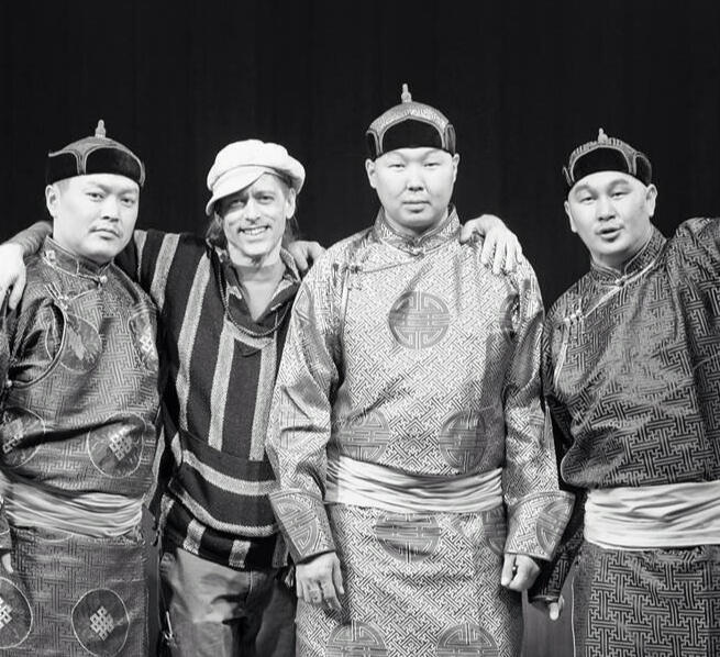 Black and white photo of the Alash Ensemble with author Michael Cline